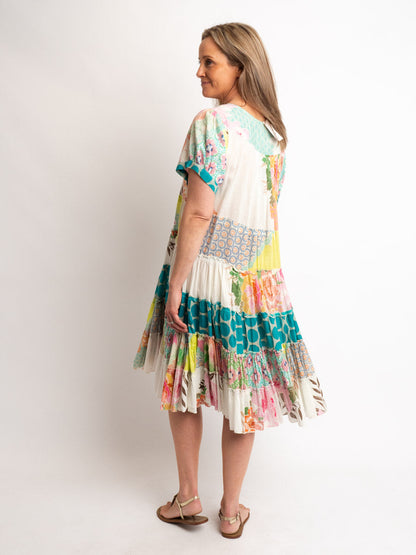 Cap sleeve knee length dress in mixed lime and pink prints