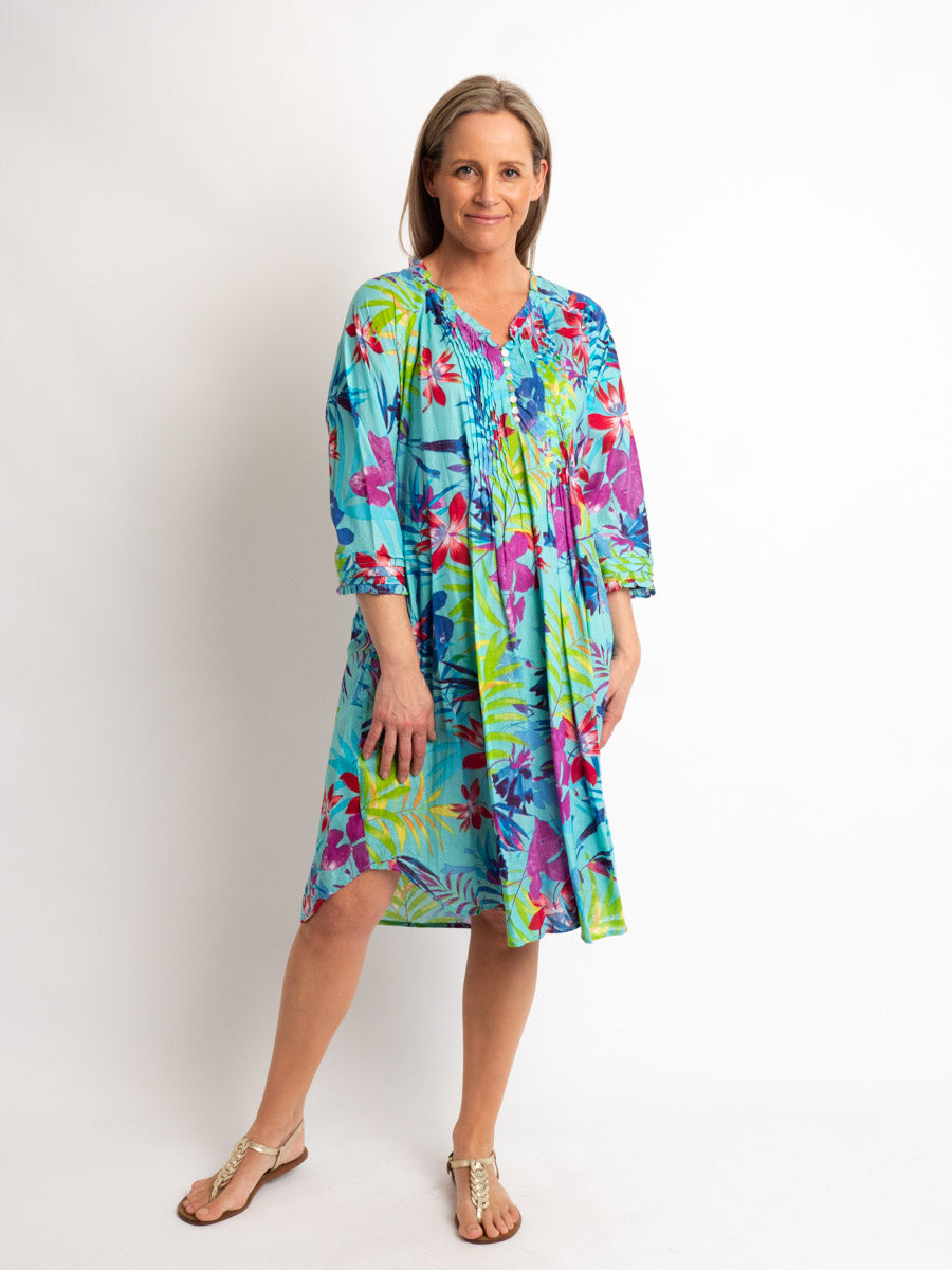 Knee-Length Pleated Dress with Subtle Frills and 3/4 Raglan Sleeve in Turquoise Tropical