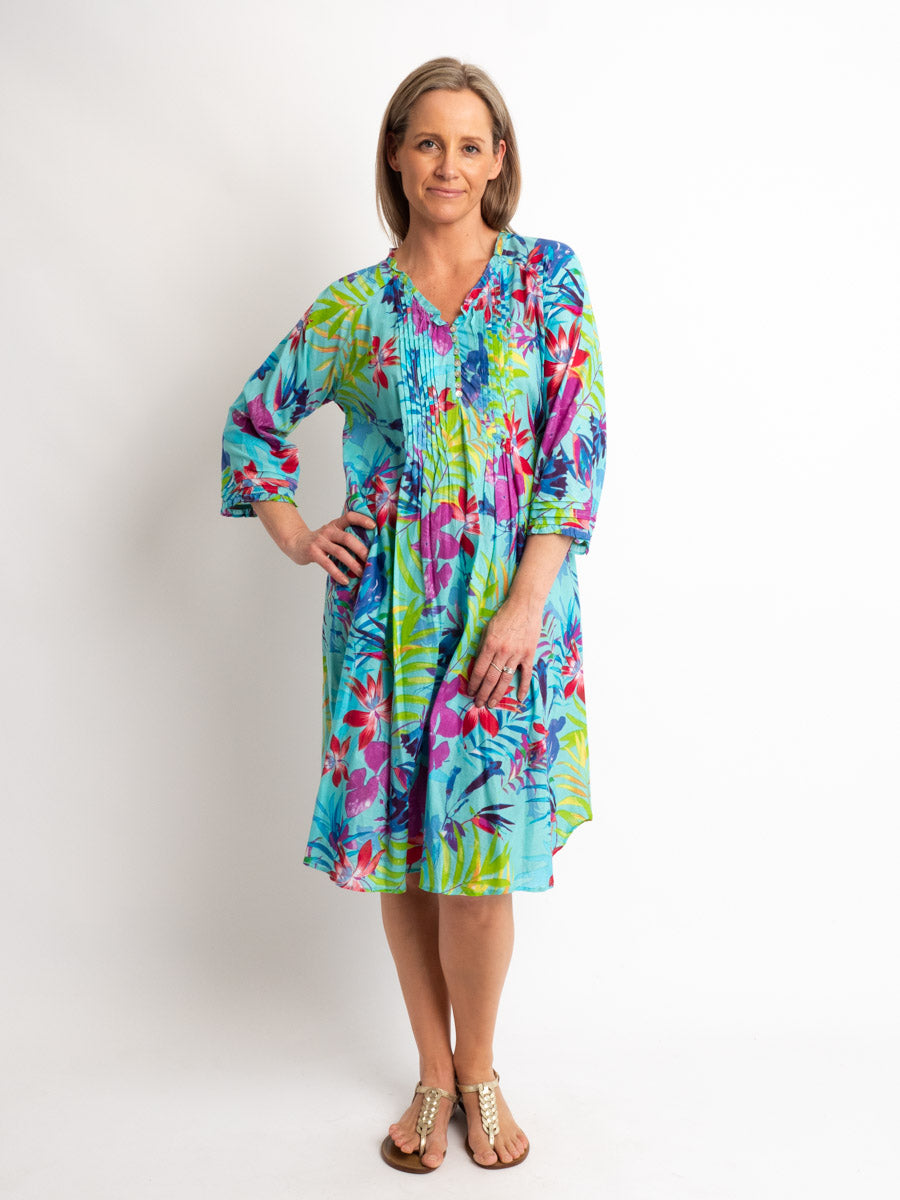 Knee-Length Pleated Dress with Subtle Frills and 3/4 Raglan Sleeve in Turquoise Tropical